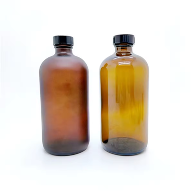 Glass Boston Round Cannabis Drink Bottles with Child Resistant Lids Amber Matte Spray options by MSN Packaging Inc.