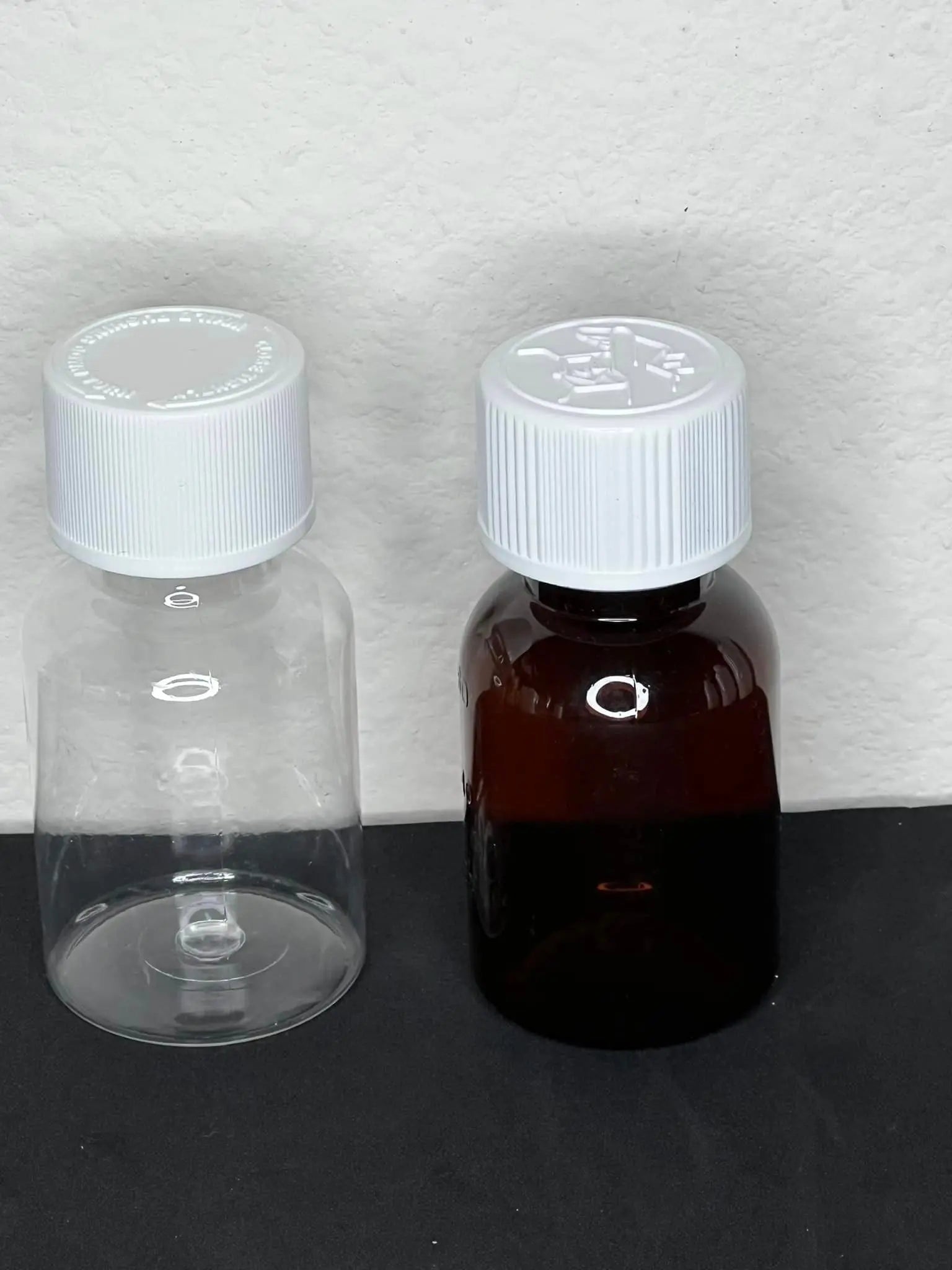 2 oz Syrup Bottle with Child Resistant and Tamper Evident lids. 28mm  neck