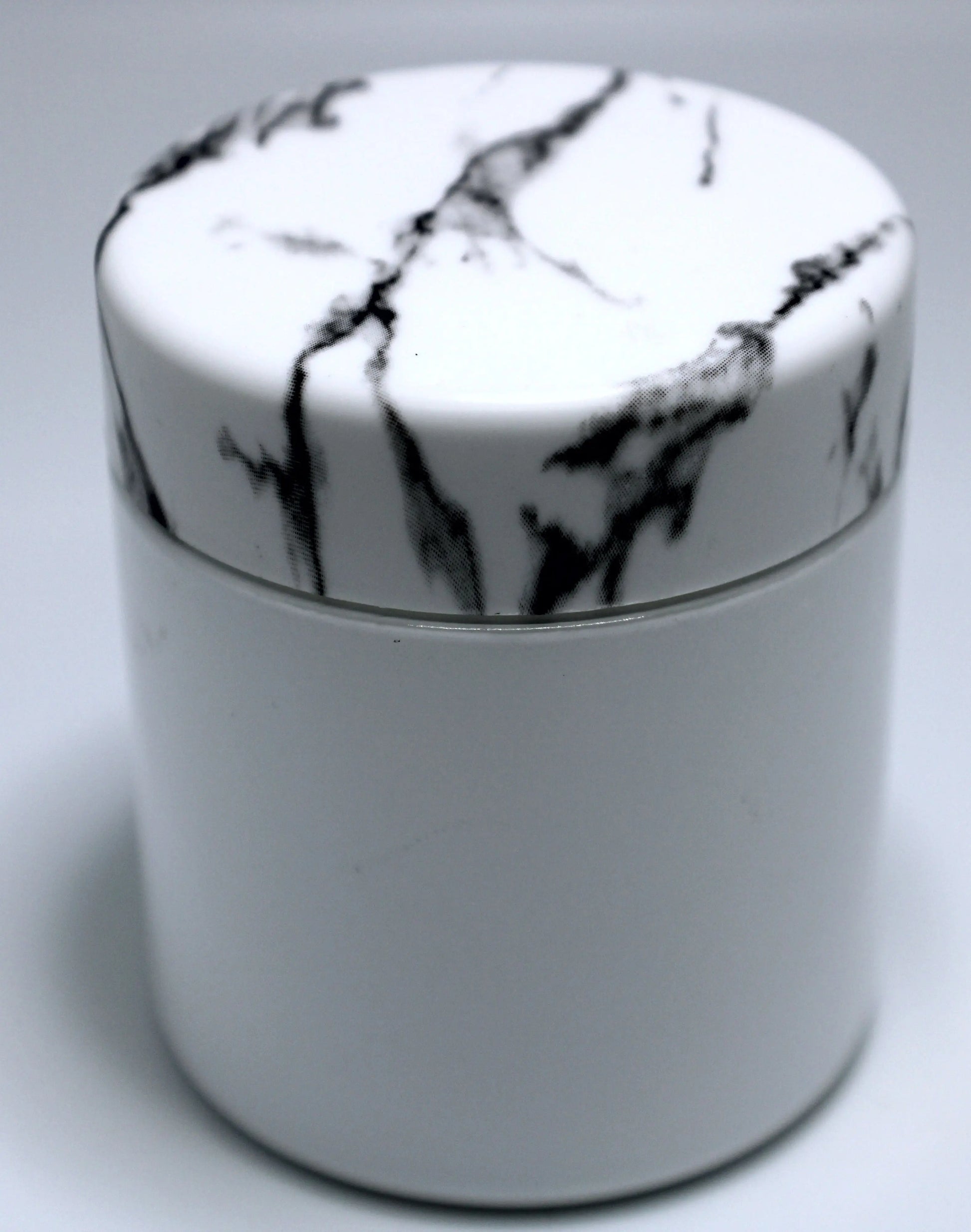 black and white marble lid and white jar for cannabis flower jars